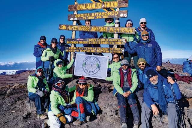 Members of Living Donor Adventures, with whom Dr. H. Albin Gritsch climbed on Mt. 乞力马扎罗, celebrate reaching the summit.